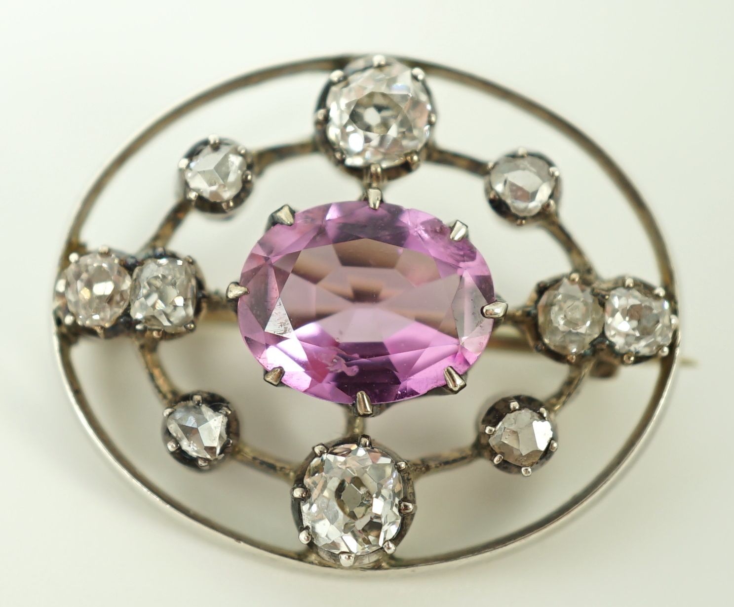 A 19th century gold and silver, pink topaz and diamond set openwork oval brooch